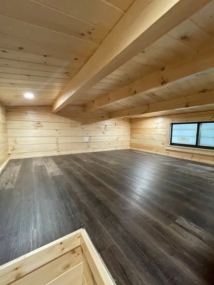 Kodiak bedroom with a vaulted ceiling and a large window