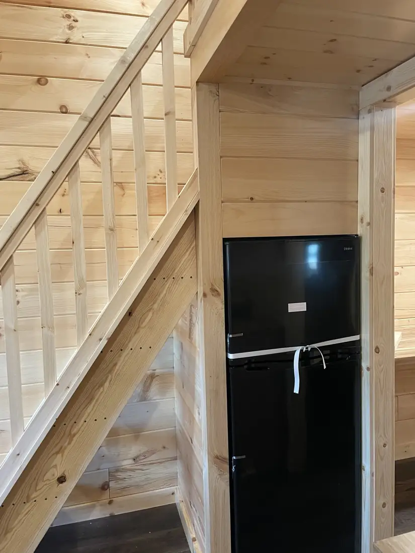 Refrigerator beside the loft ladder