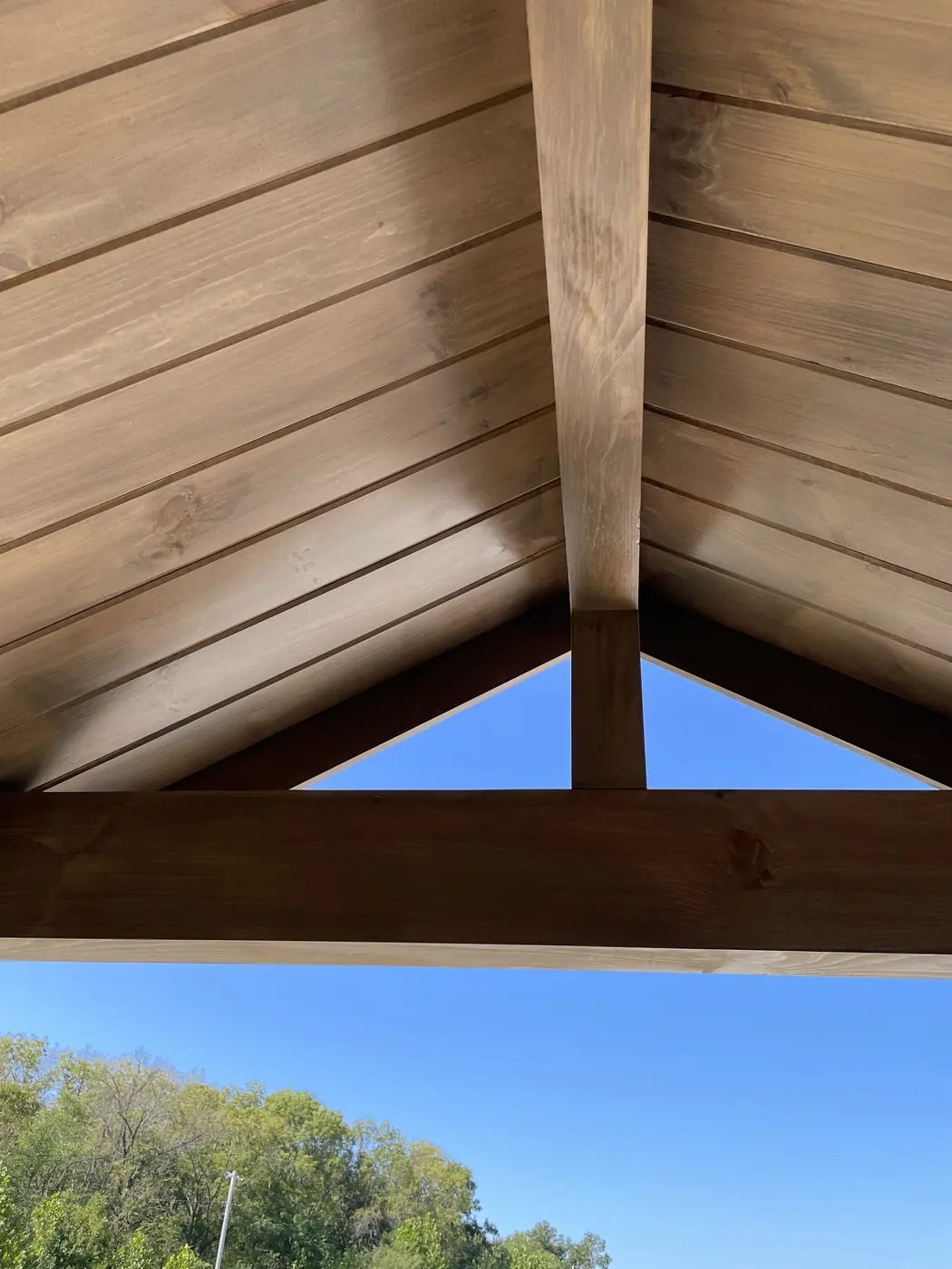 Timber roof beams under the porch gable