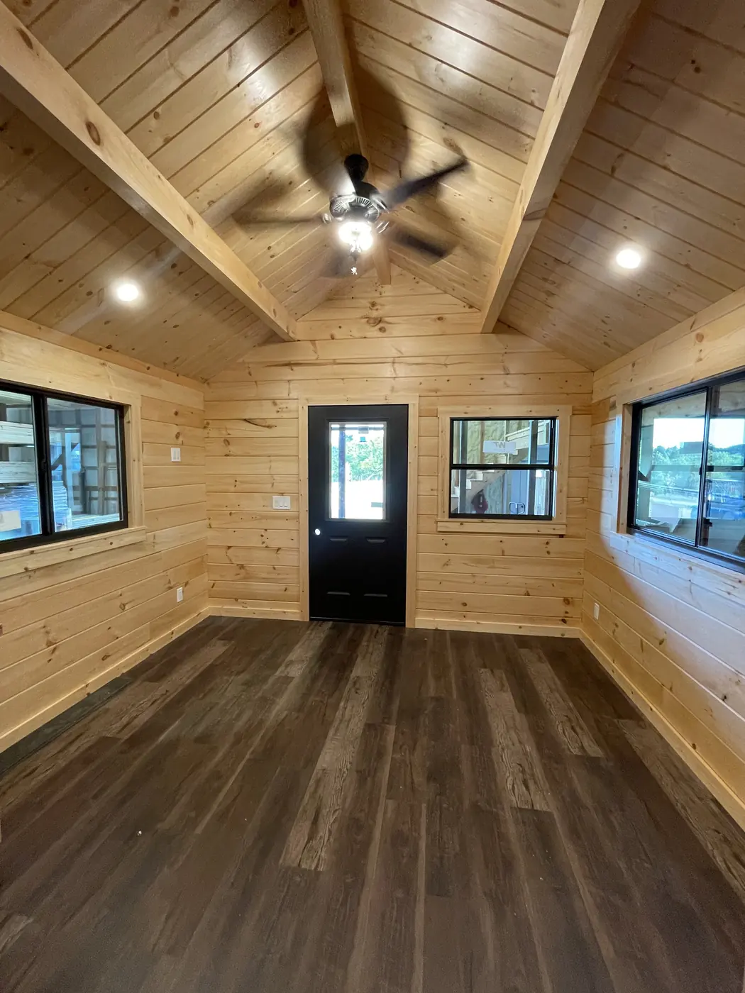 Clear-coated pine walls and vaulted pine ceiling inside the cabin