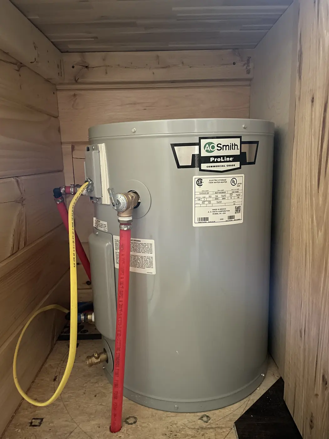 A.O. Smith water heater with its water lines connected