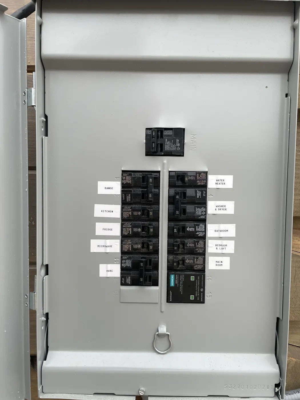 Open breaker panel with labeled breakers