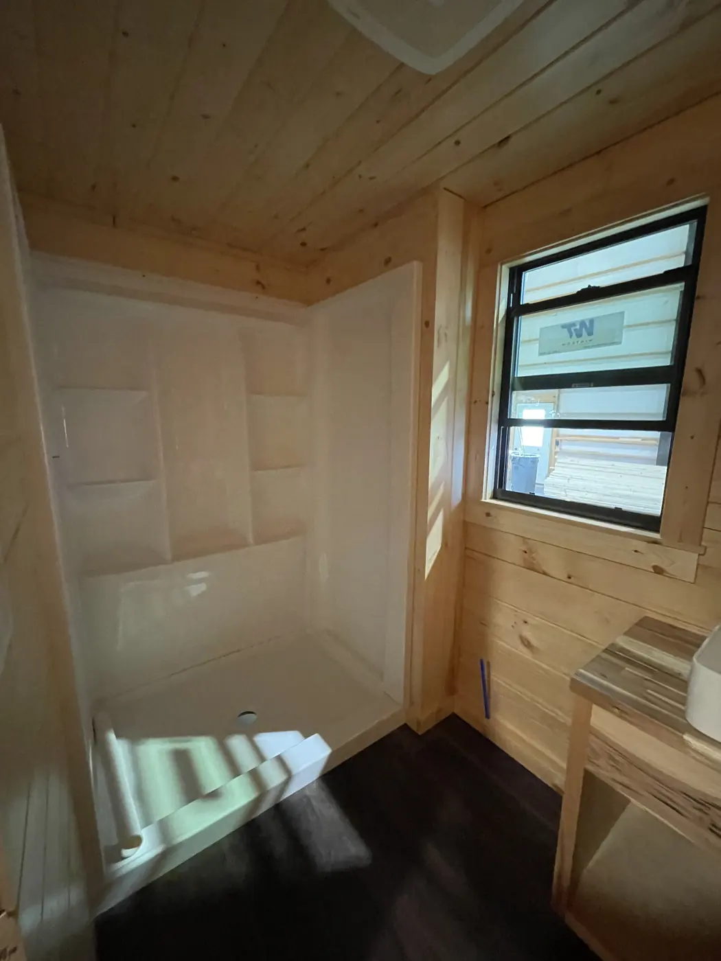 Shower surround in the cabin bathroom